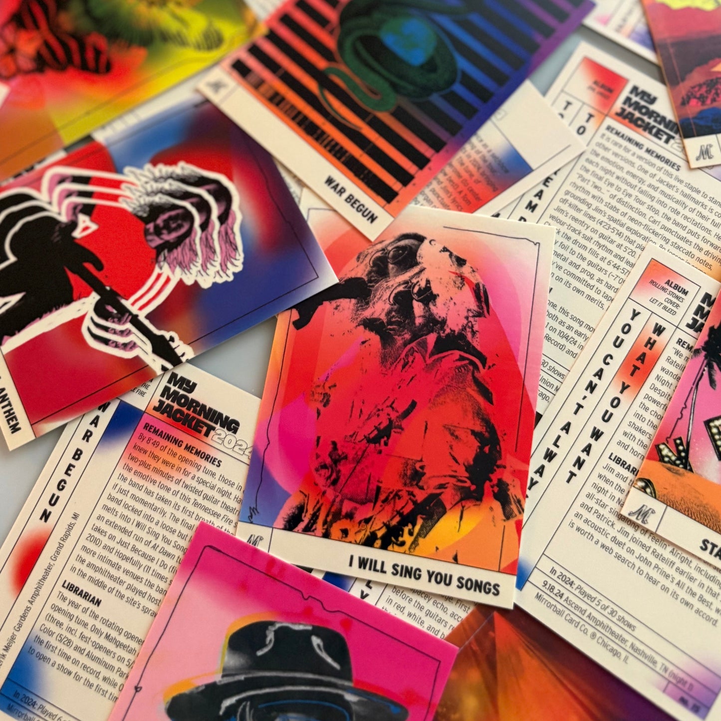 Collection of colorful trading cards with various designs