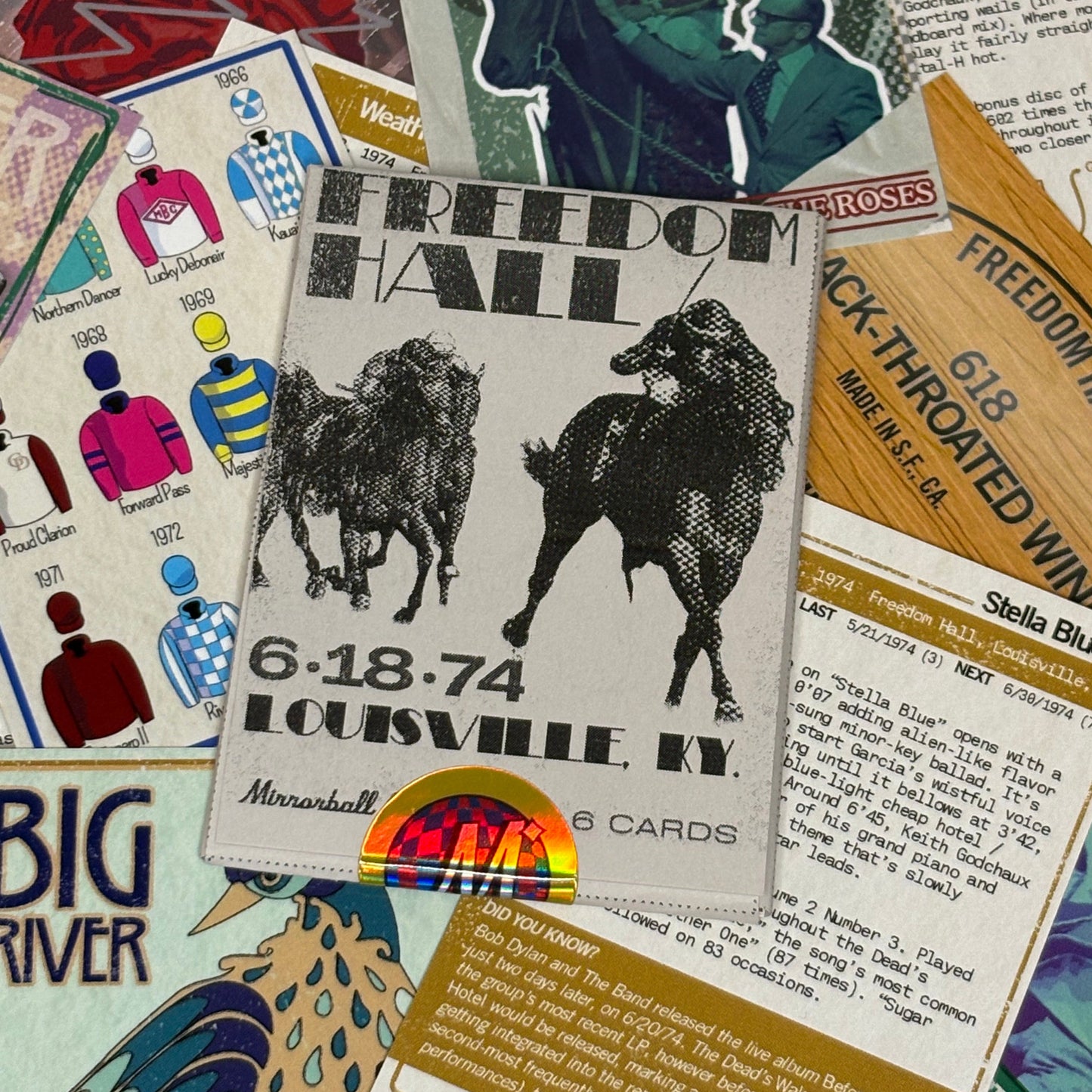 Card package on a bed of individual cards included in the set