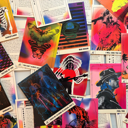 Collection of colorful trading cards with artistic designs.